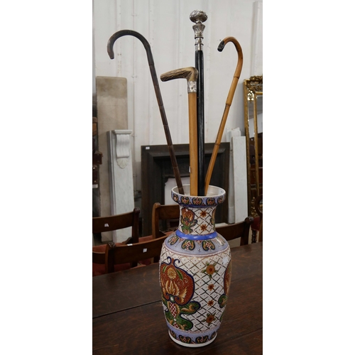 394 - A Chinese porcelain vase and assorted walking sticks