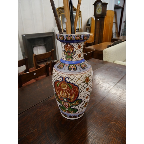 394 - A Chinese porcelain vase and assorted walking sticks