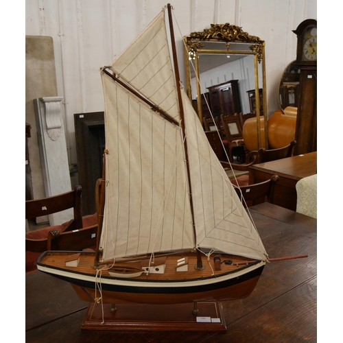 398 - A model wooden yacht