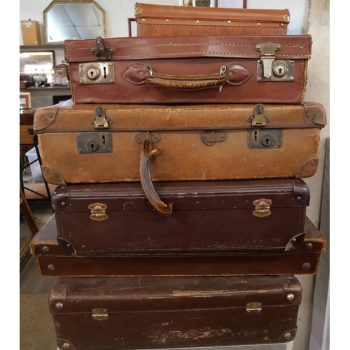 412 - Ten vintage suitcases