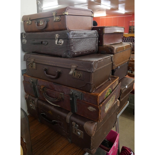 412 - Ten vintage suitcases