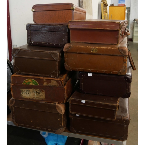 412 - Ten vintage suitcases