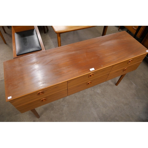 55 - A teak six drawer sideboard