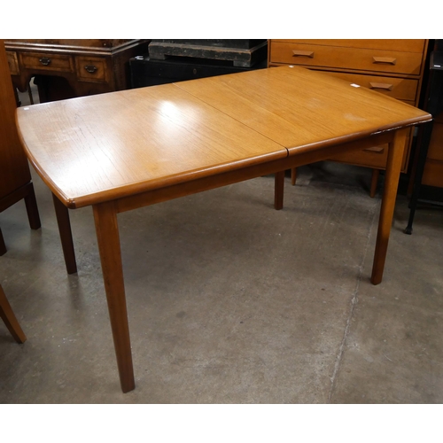 56 - A teak extending dining table