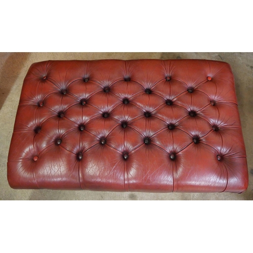 74 - A large oxblood red leather footstool