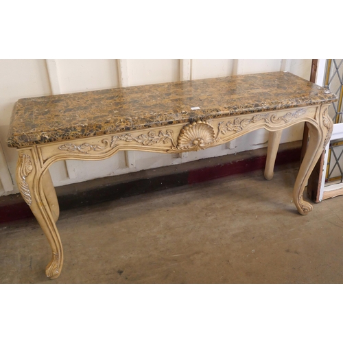 78 - An Italian Rococo style painted faux marble console table