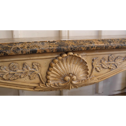 78 - An Italian Rococo style painted faux marble console table