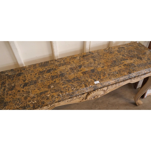 78 - An Italian Rococo style painted faux marble console table