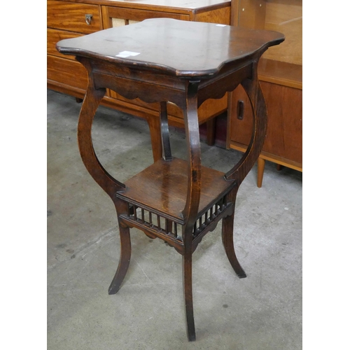 79 - An Edward VII oak two tier jardiniere stand