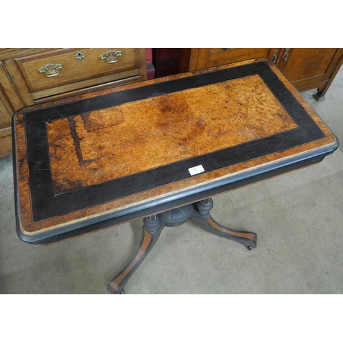 82 - A Victorian ebonised and amboyna rectangular fold over card table, manner of Lambs, Manchester