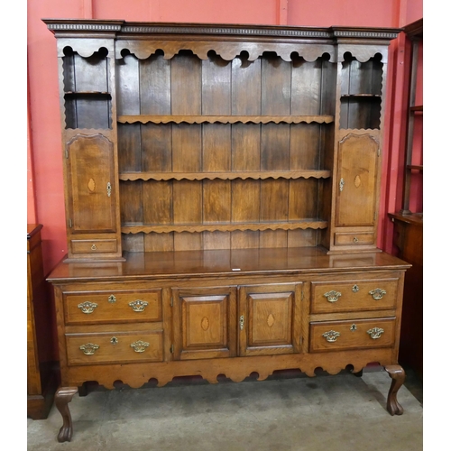 83 - A George II style inlaid oak dresser