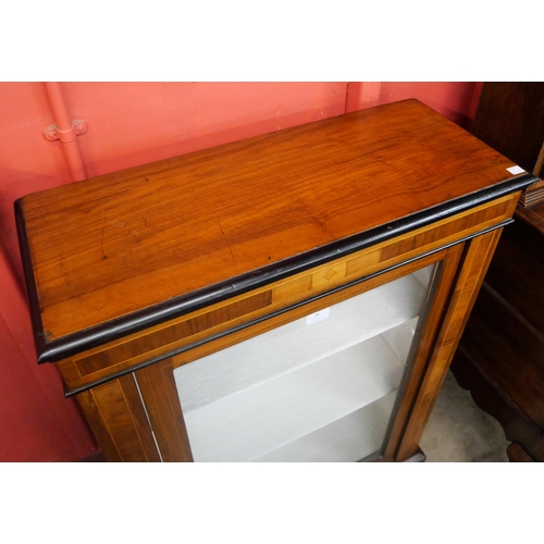 86 - A Victorian inlaid walnut pier cabinet