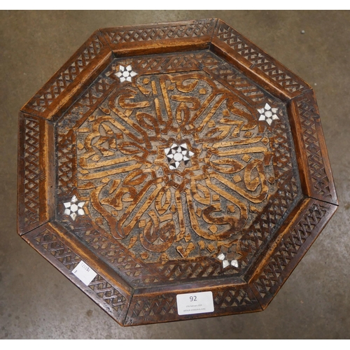 92 - A Moorish mother of pearl inlaid hardwood octagonal occasional table