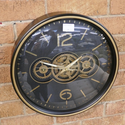 1498 - A black and gold moving gears wall clock