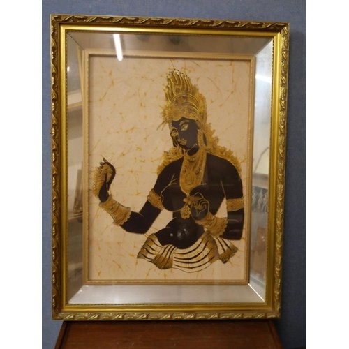 364A - An oriental print of a deity, framed