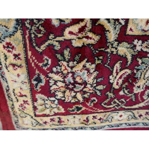 1331 - A multi-coloured ground Kashan rug with medallion design, 135 x 195cm