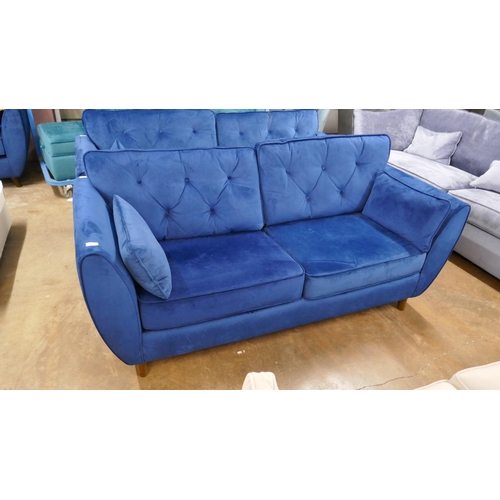 1398 - A Hoxton blue velvet three seater sofa, RRP £799