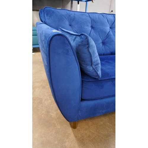 1398 - A Hoxton blue velvet three seater sofa, RRP £799