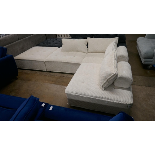 1401 - A cream upholstered modular corner sofa