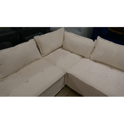 1401 - A cream upholstered modular corner sofa