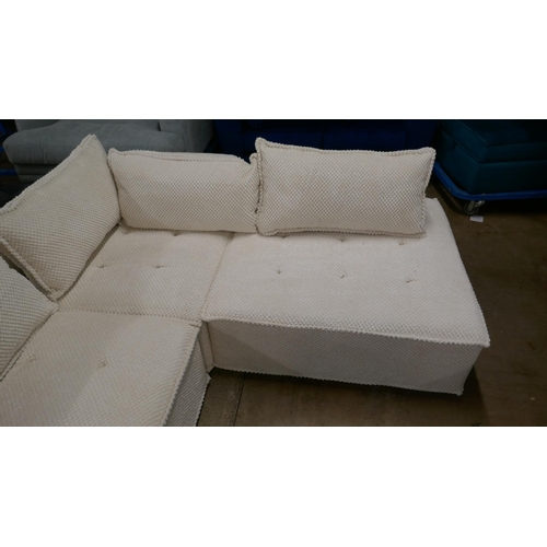 1401 - A cream upholstered modular corner sofa