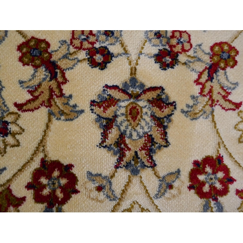 1424 - An ivory ground full pile Cashmere carpet, with all over floral pattern and gold border, 200x300cm