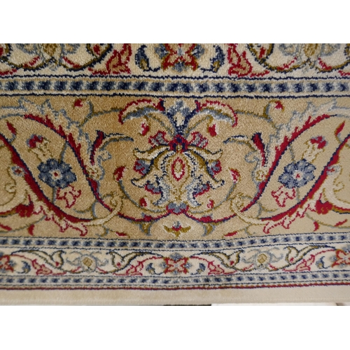 1424 - An ivory ground full pile Cashmere carpet, with all over floral pattern and gold border, 200x300cm