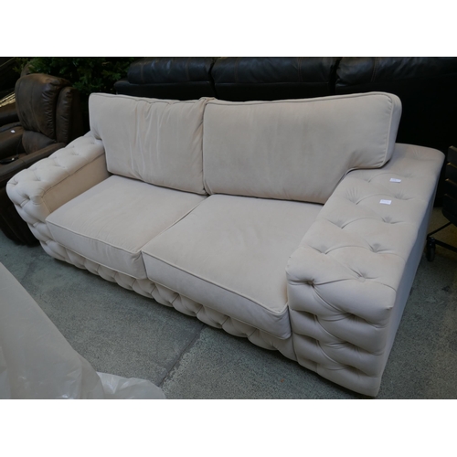 1528 - A cream velvet buttoned sofa bed