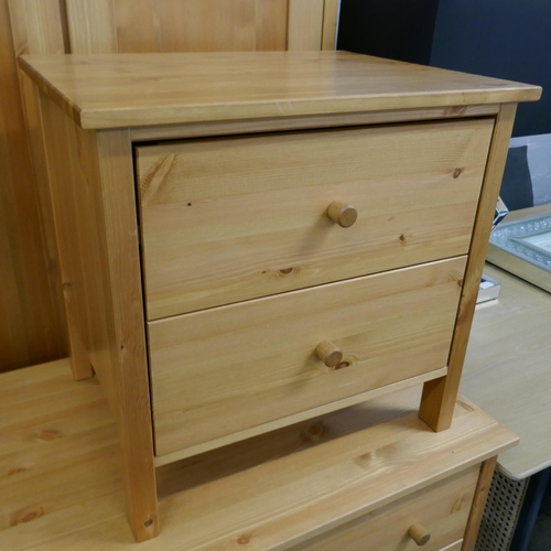 1555 - A pine wardrobe, a chest of drawers and a pair of bedside chests - boxed * this lot is subject to VA... 