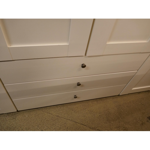 1556 - A four door white wardrobe with built in chest of drawers - marked * this lot is subject to VAT