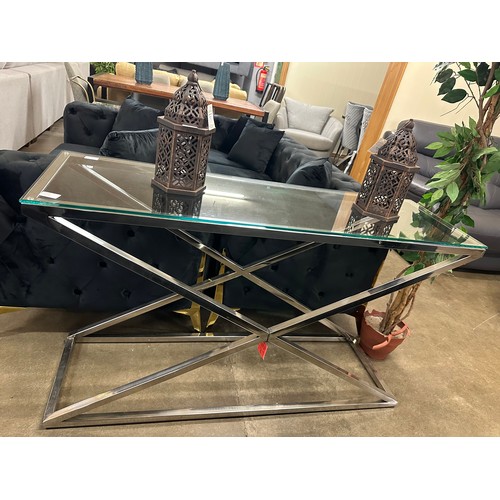 1355 - A glass and chrome console table * this lot is subject to VAT