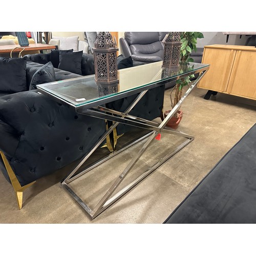 1355 - A glass and chrome console table * this lot is subject to VAT