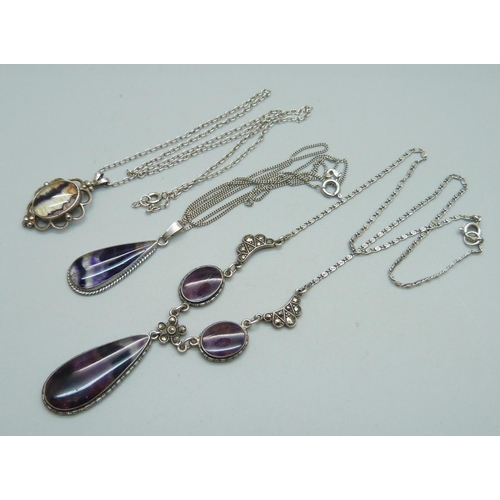 1009 - Two silver and Blue John pendants and a similar necklace