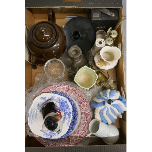 1058 - Two boxes of assorted china, metalwares, needleworks and a Manor Collectibles model of a British Bul... 