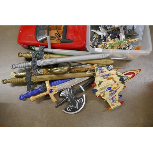 1066 - A collection of model vehicles, aircraft and toy swords **PLEASE NOTE THIS LOT IS NOT ELIGIBLE FOR P... 