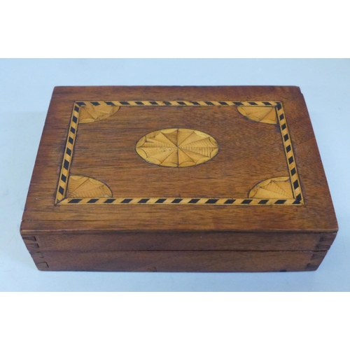 613 - An Edward VII inlaid mahogany two compartment card box and two packs of cards