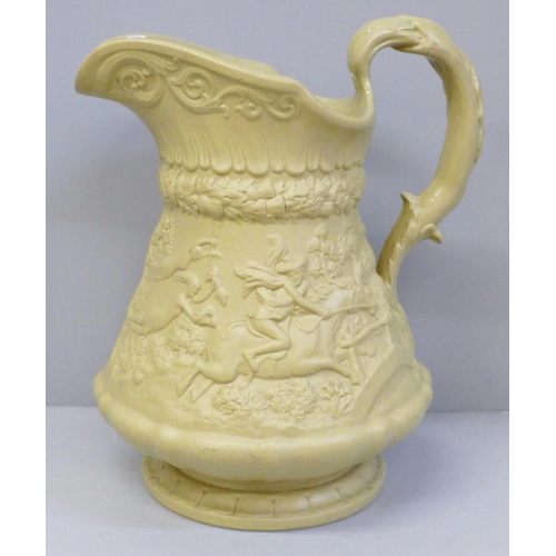 622 - A Ridgway buff embossed jug decorated with Tavern scene and Highwayman scene