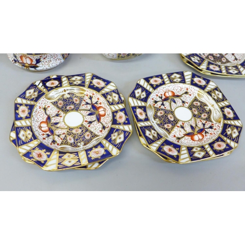 625 - A Carlton Ware Imari pattern sandwich set; a large plate and six small plates, milk and sugar