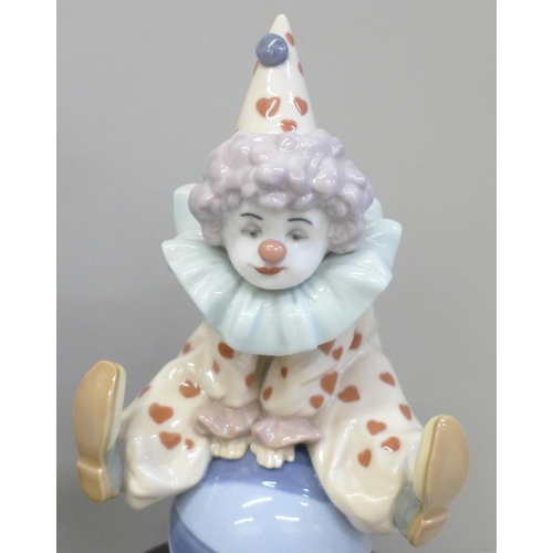 632 - Two Lladro clowns on wooden bases, Having a Ball and The Magician's Hat