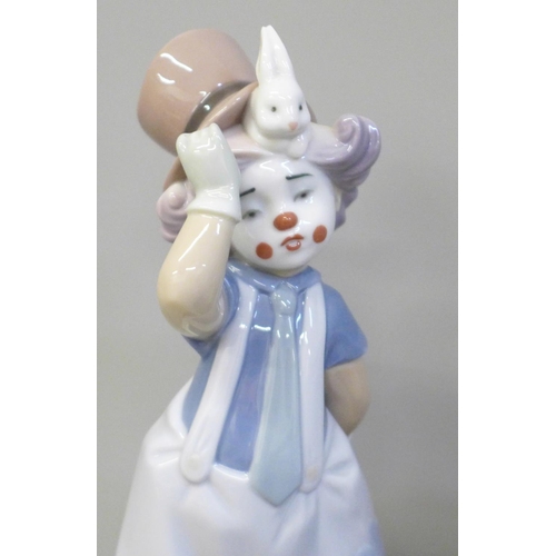 632 - Two Lladro clowns on wooden bases, Having a Ball and The Magician's Hat