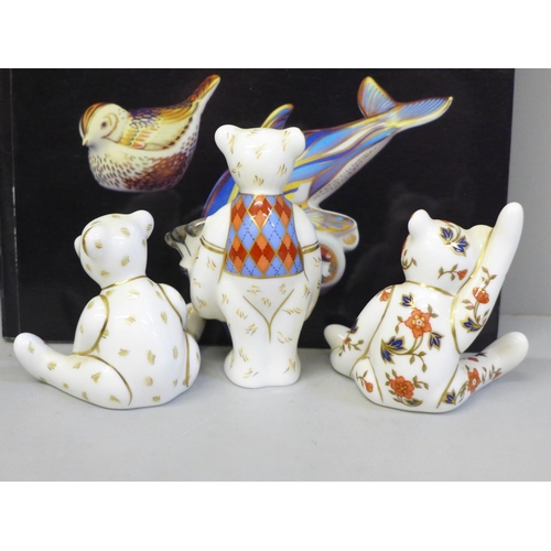 633 - Three Royal Crown Derby paperweights, Golfer Bear, two others and a Collector's Guide