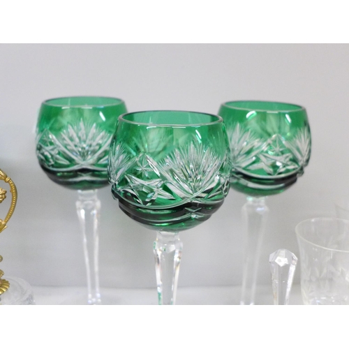 662 - Four Bohemian green glass cut wine glasses and matching bell, two crystal bells with gilded heart ha... 