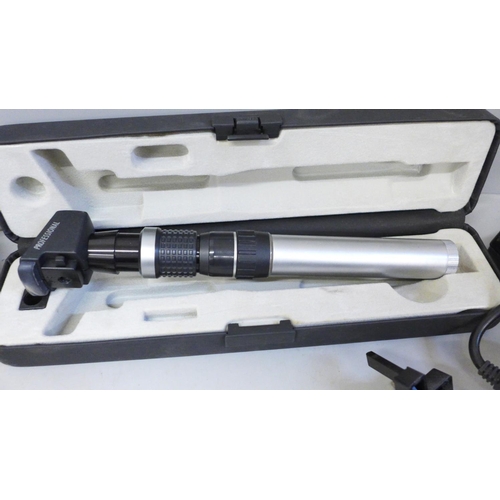 672 - Two Keeler portable ophthalmoscopes, one marked 'Specialist', other marked 'Professional', both case... 