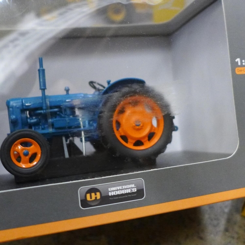 692 - Four model vehicles; three Britains JCB, a Fordson Power Major by Universal Hobbies and other model ... 