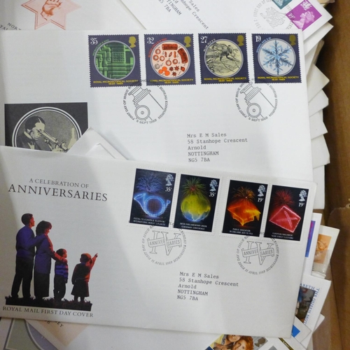 693 - Approximately 150 first day covers and an empty stamp album