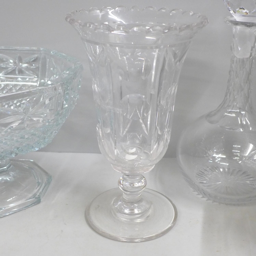 A cut glass decanter and faceted ball stopper, cut glass water jug, a