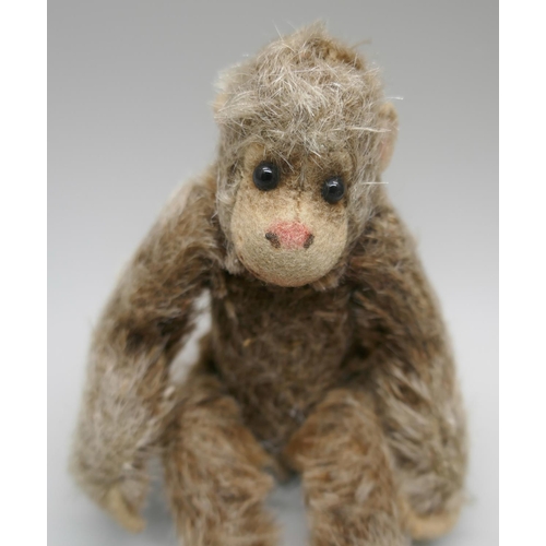 867 - Two small vintage Teddy bears, including one Steiff and a small toy monkey