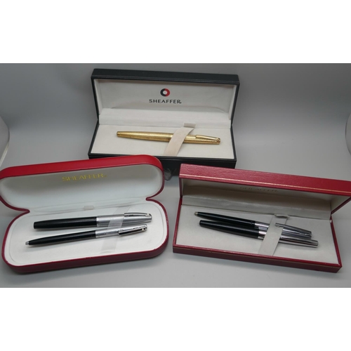 879 - A plated Sheaffer pen with 14k gold nib and two Sheaffer pen sets