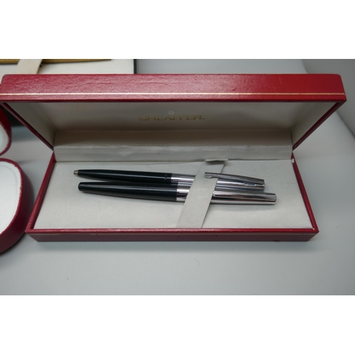 A plated Sheaffer pen with 14k gold nib and two Sheaffer pen sets