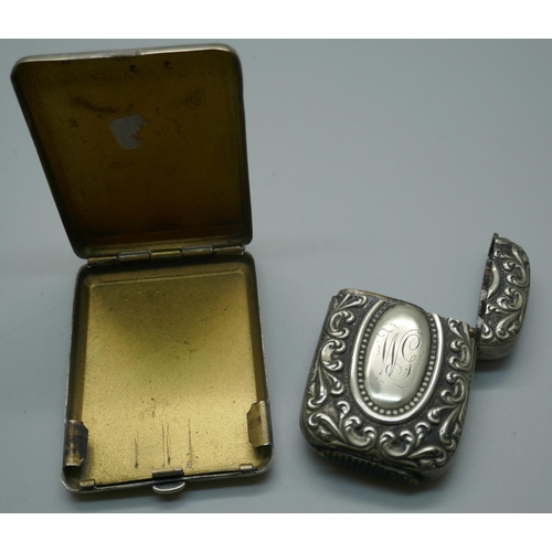 896 - A powder case, a claret decanter label, an inkwell, a lighter, three bracelets with charms, a Women'... 